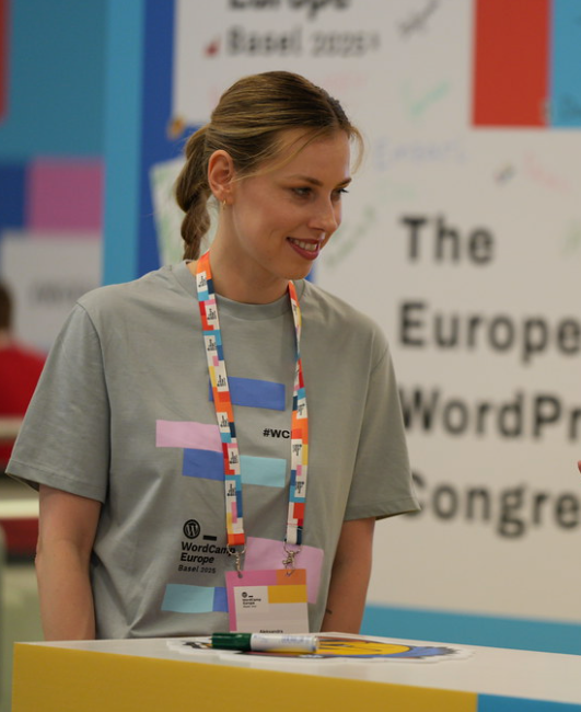Aleksandra Hola volunteering at WordCamp Europe Basel 2025